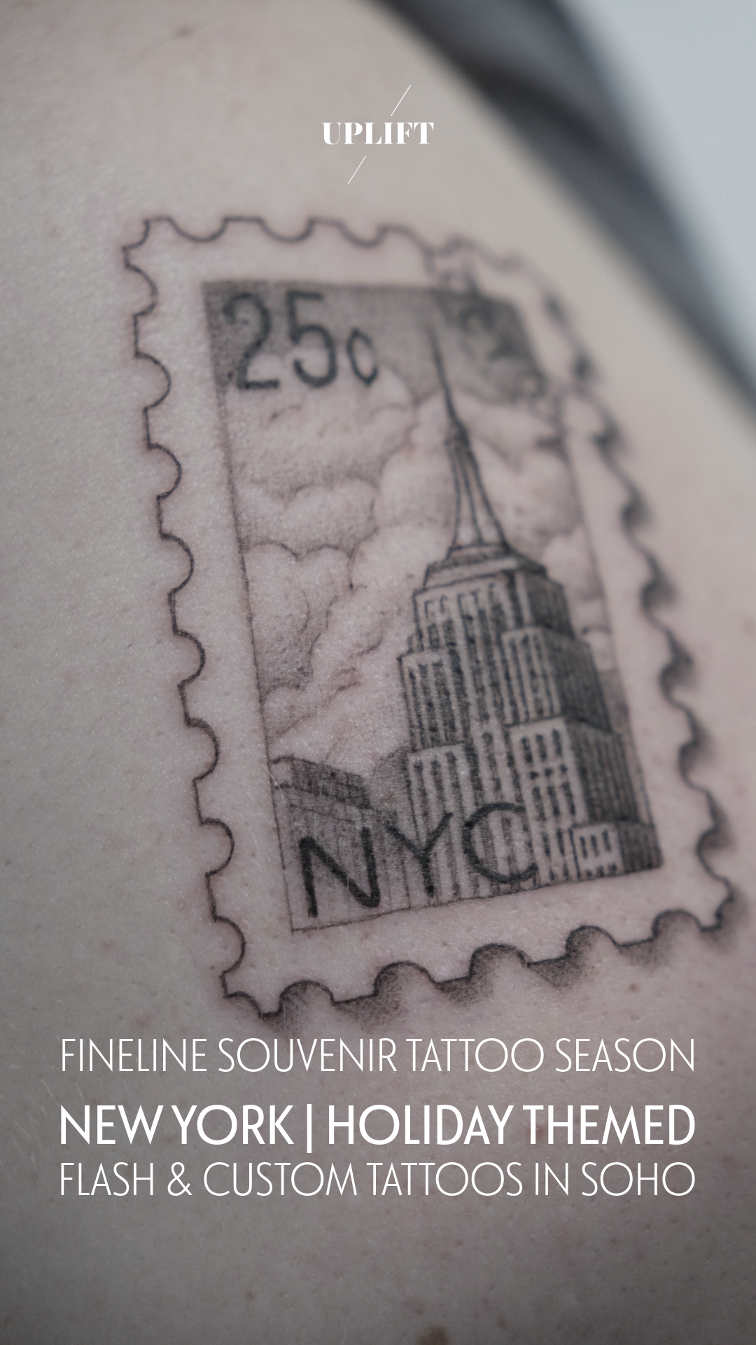 Close-up of a tattoo resembling a vintage New York City postage stamp showing the Empire State Building, with clouds in the background and the denomination 25¢.