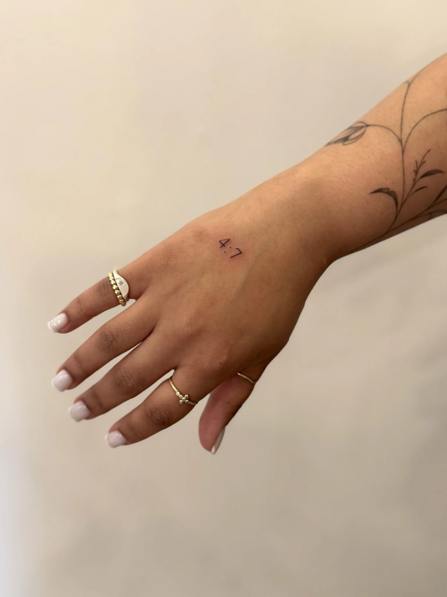 julia-fineline-number-date-floral-tattoo-soho-nyc-uplift.jpg
