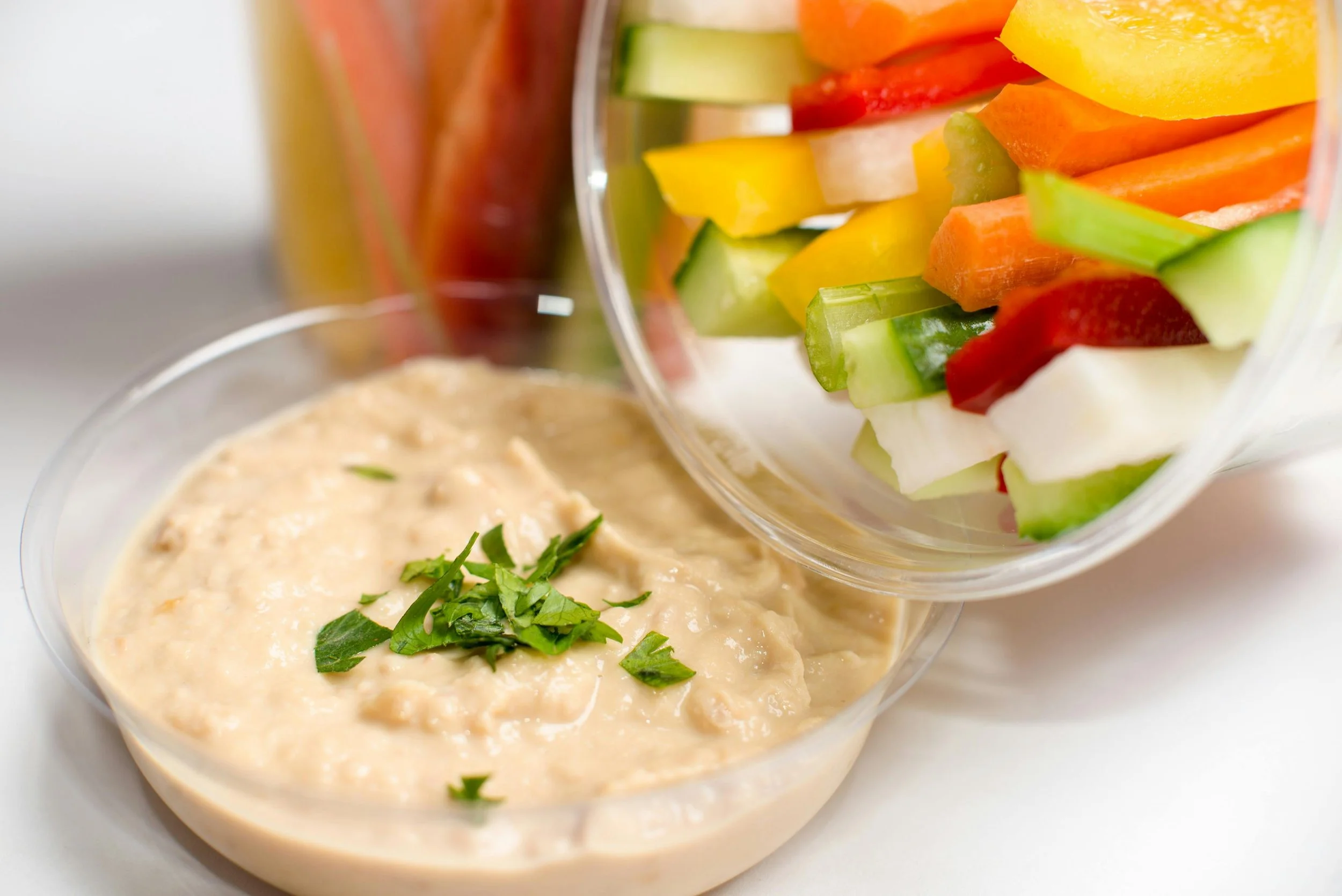 Protein focused snack bowl with hummus and fresh vegetables