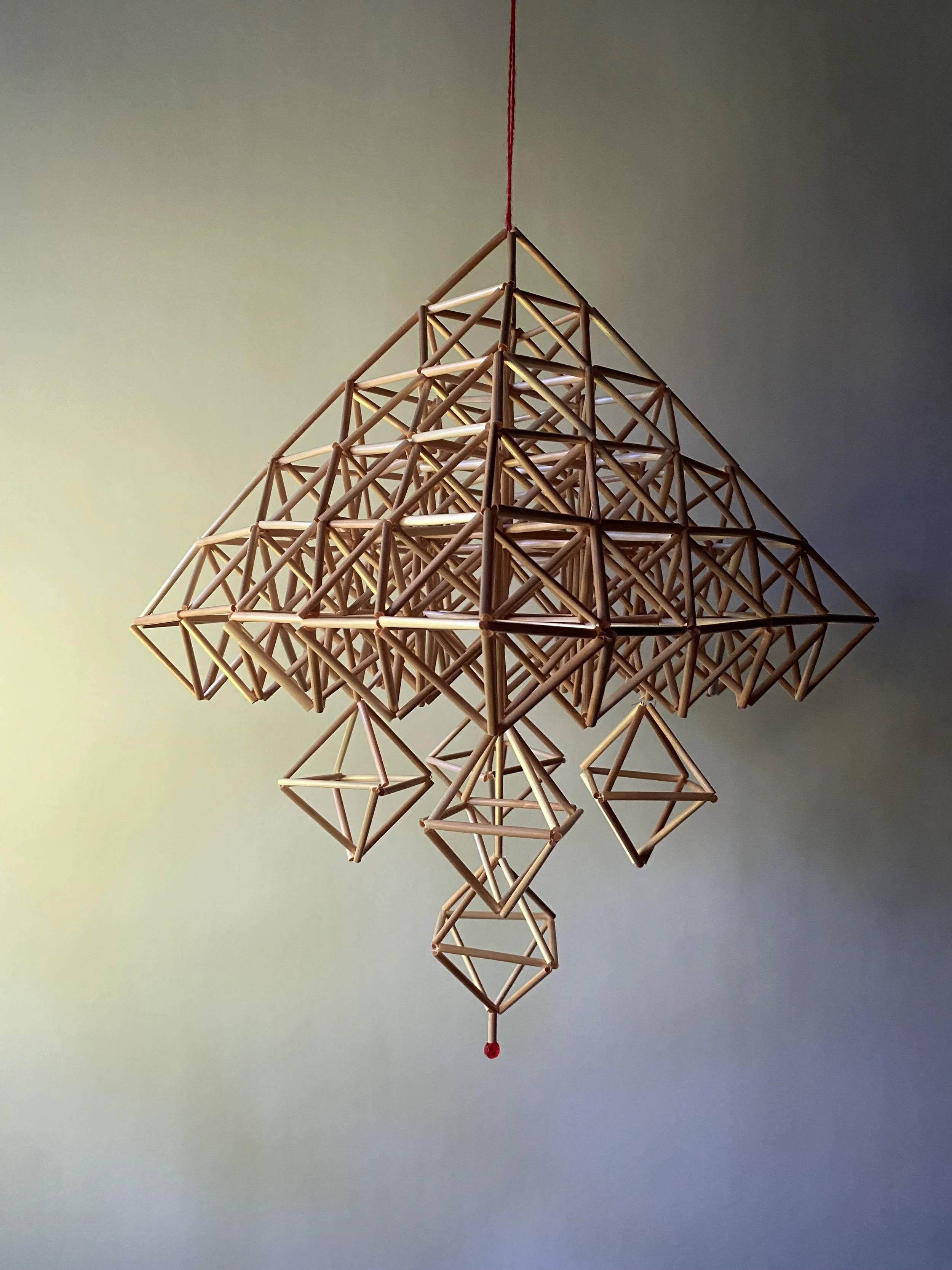"Himmeli for Mary" made with rye straw, red beads and cotton thread