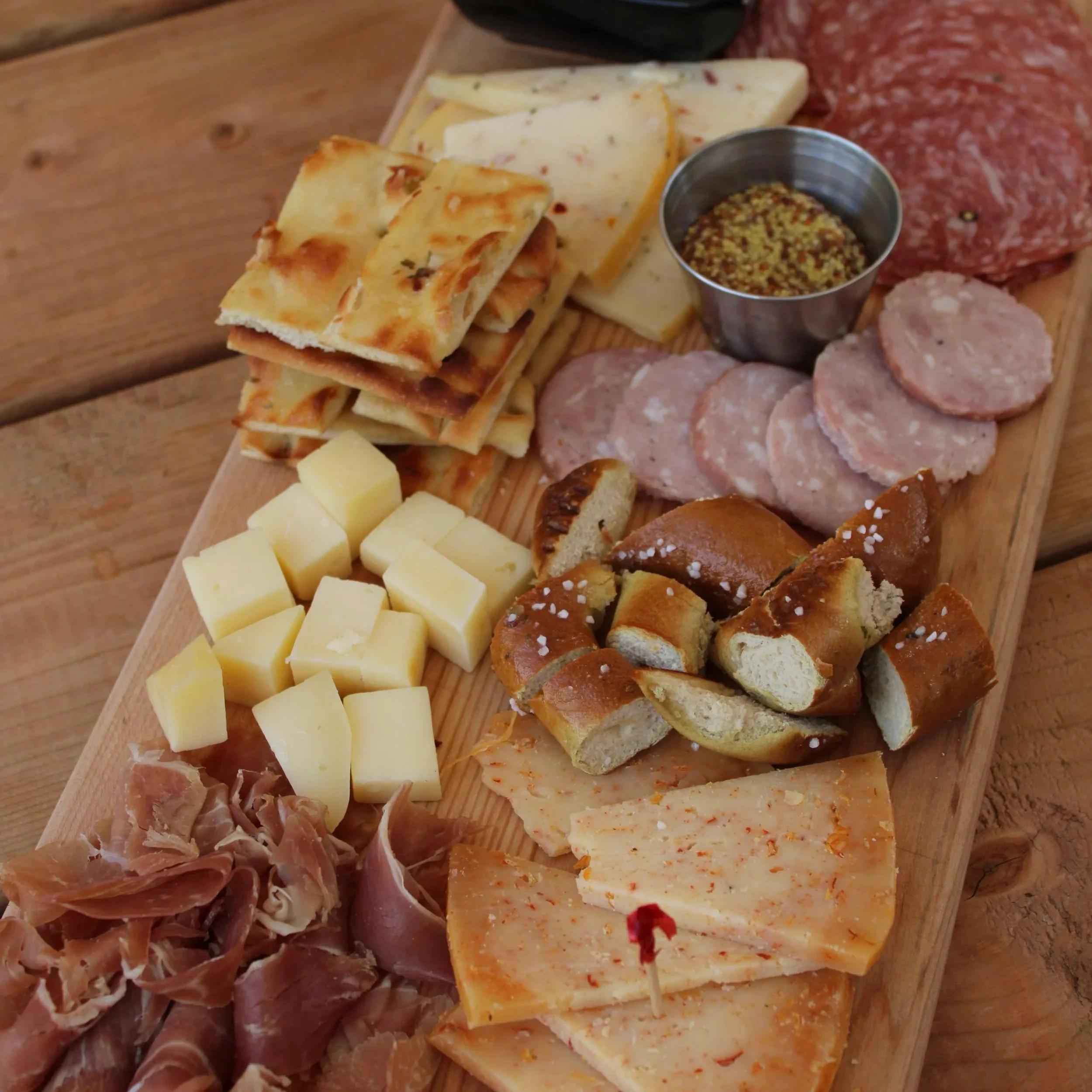  Butcher's Board 
Three varieties of cured meats, sliced fresh in house, each paired with local cheeses. Accompanied with baby pickles, olives, and toasted focaccia.
