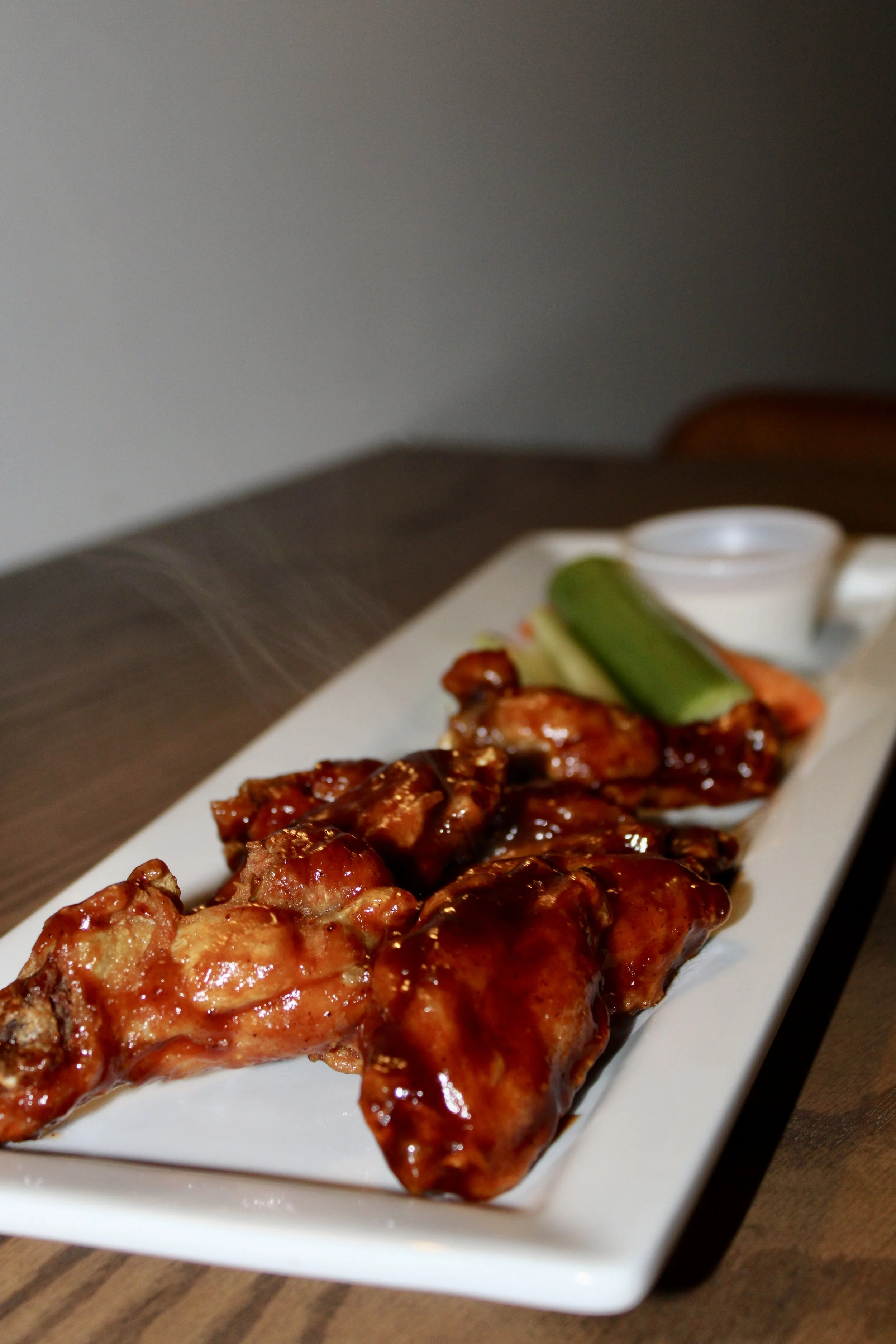  Chicken Wings 
1 lb of either lightly dusted bone-in OR crispy boneless wings* served with carrots, celery and ranch.