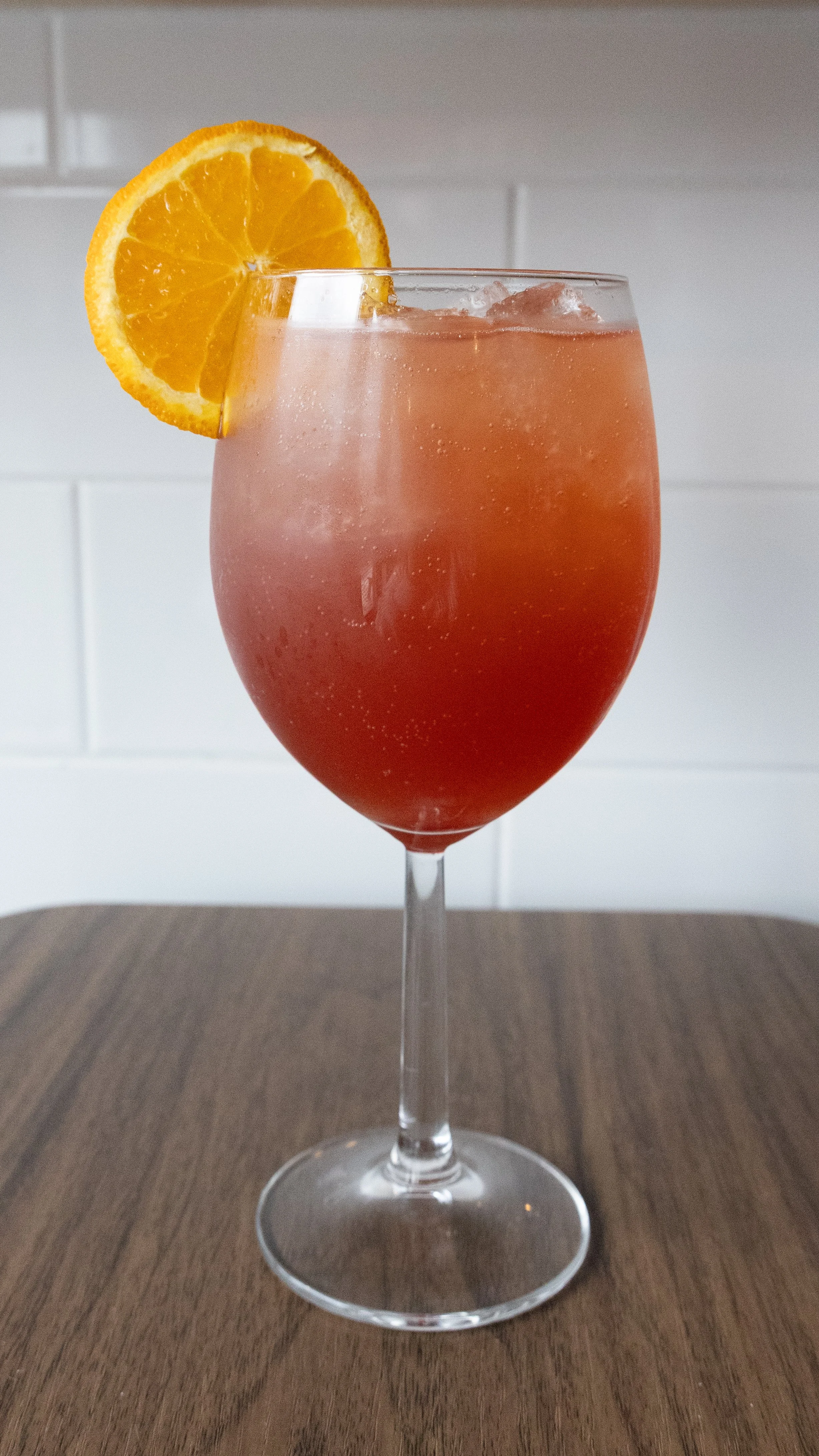  Still Summer Spritz 
NE1 Vodka, aperol, orange juice &amp; blackberry syrup. Topped with soda &amp;
garnished with a orange wheel.