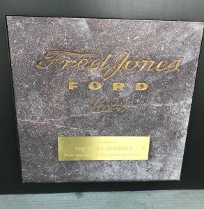 Close-up of a custom cast metal plaque for The Jones Assembly, displayed at the renovated historic building in Oklahoma City