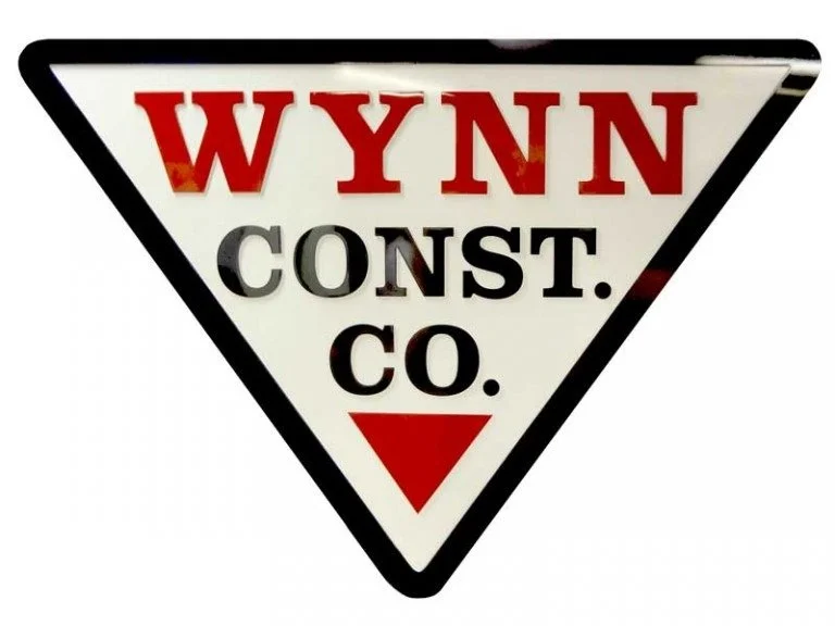 Custom metal logo signage for a construction company featuring durable dimensional building signage and professional commercial branding design.