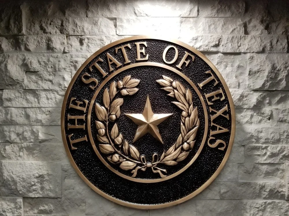 Custom cast bronze Texas state seal plaque featuring durable cast metals, dimensional detailing, and architectural memorial signage craftsmanship.