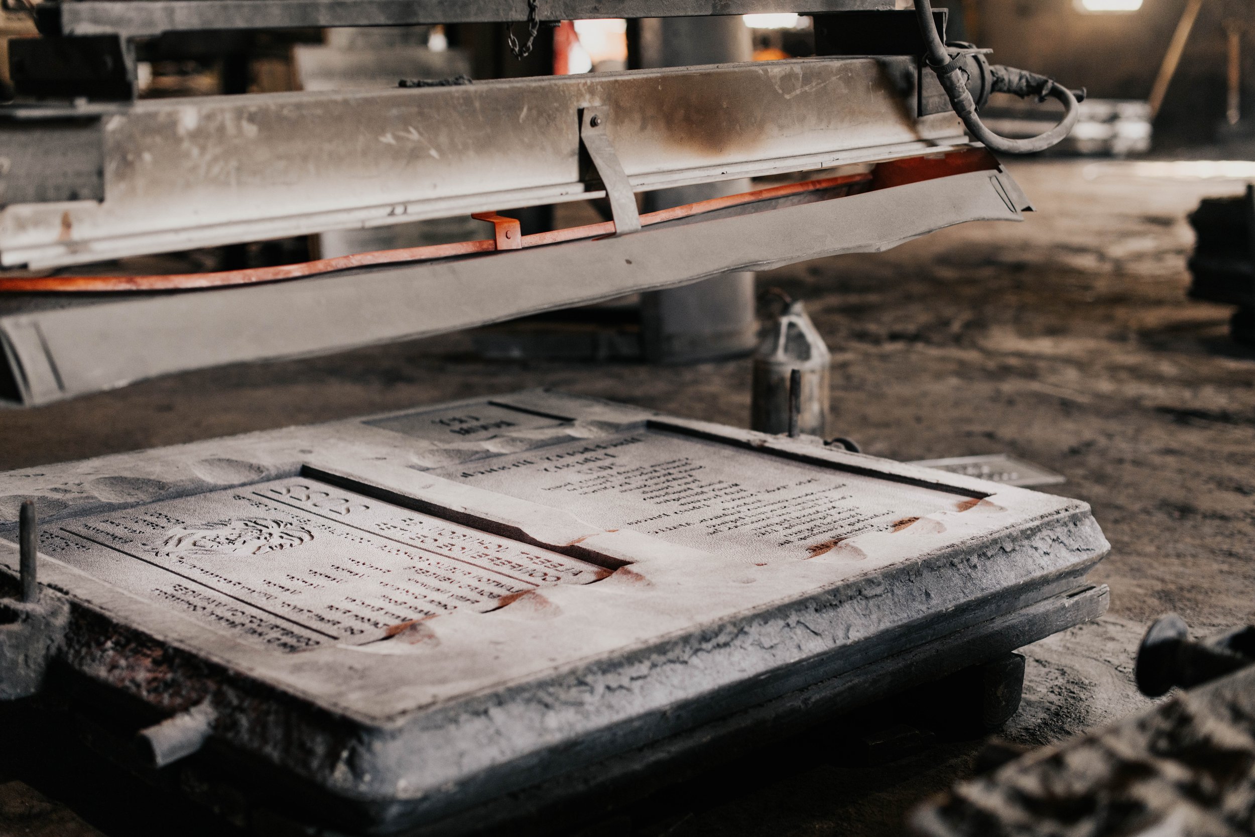 Metal signage molds in production during A.R.K. Ramos foundry services for custom signs and durable signage.
