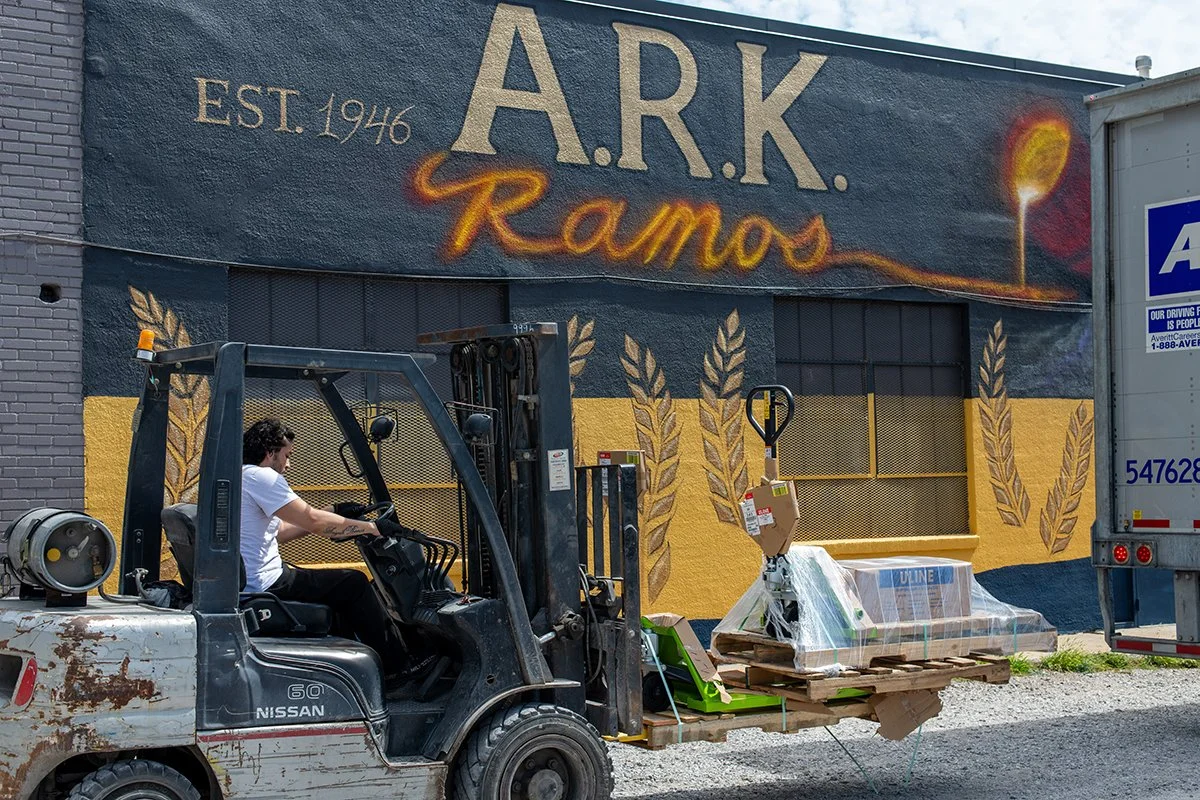 Exterior view of the A.R.K. Ramos foundry, established in 1946, known for its high-quality custom plaques and metal signage. The foundry's iconic mural reflects its long-standing history in metal casting and fabrication.