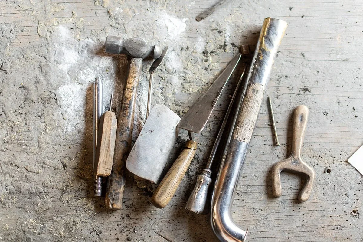 Traditional foundry tools used in sign restoration and refinishing metal at A.R.K. Ramos, supporting the repair and preservation of legacy metal signage.