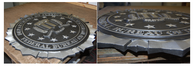 Close-up of textured background and precision lettering on a cast plaque.