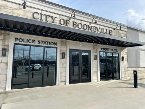 Custom building signage installed on a municipal construction project featuring dimensional metal letters for new building construction and contractor signage solutions