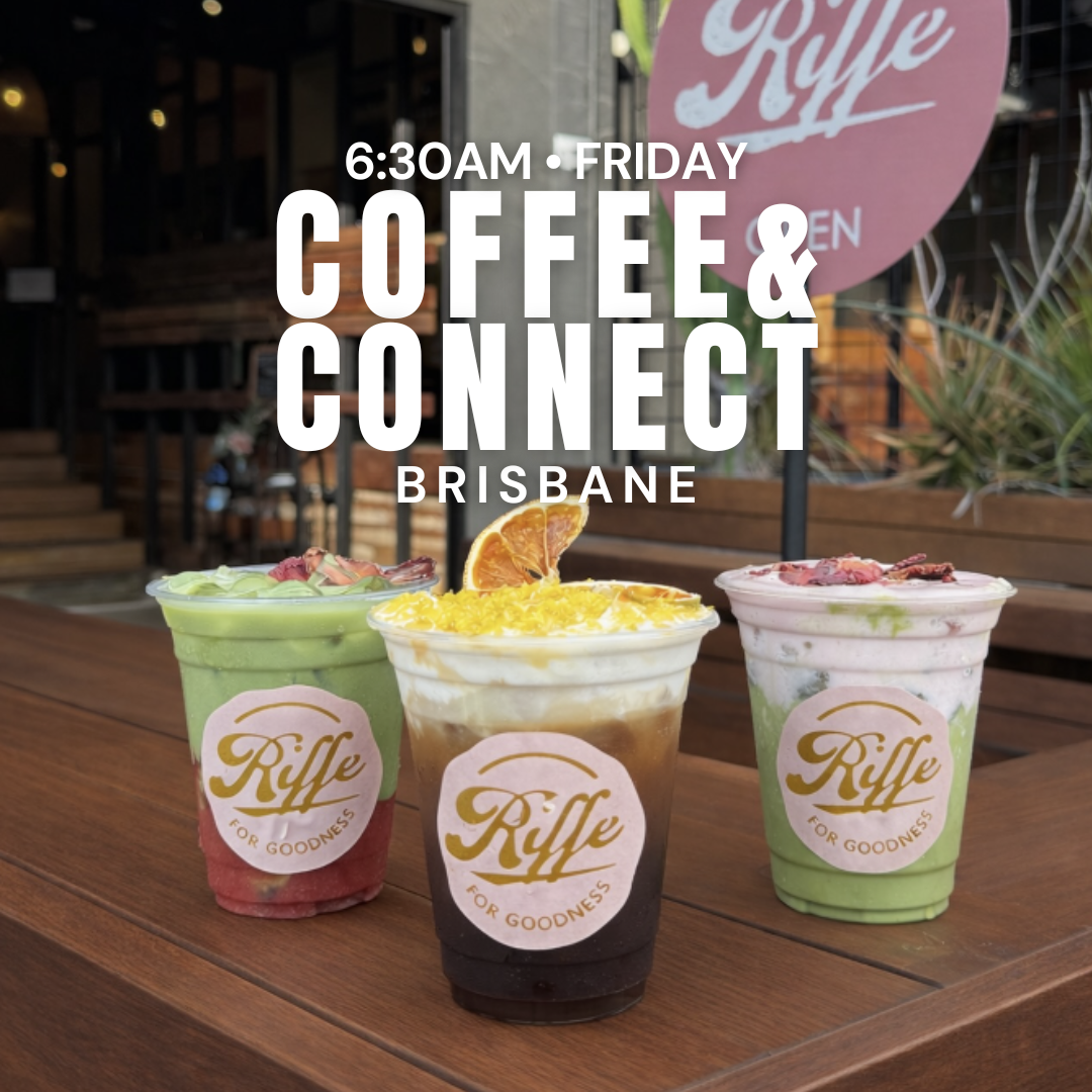 A group of women sitting around a table in a bright, sunny cafe with outdoor-style decor, including green cushions and woven lampshades, engaging in conversation.