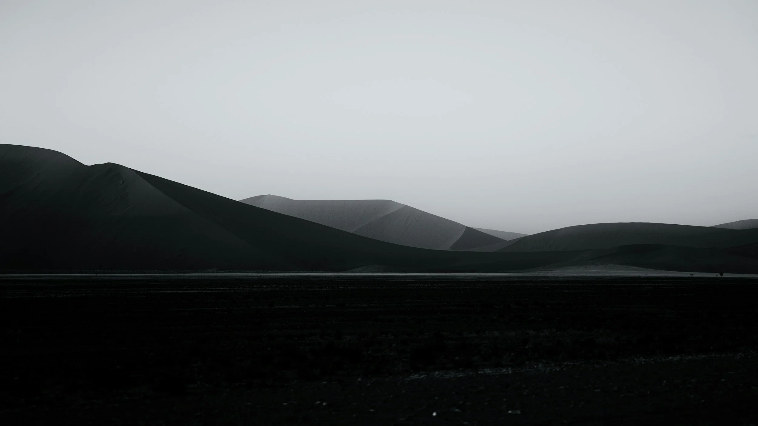 Black and white image of sand dunes