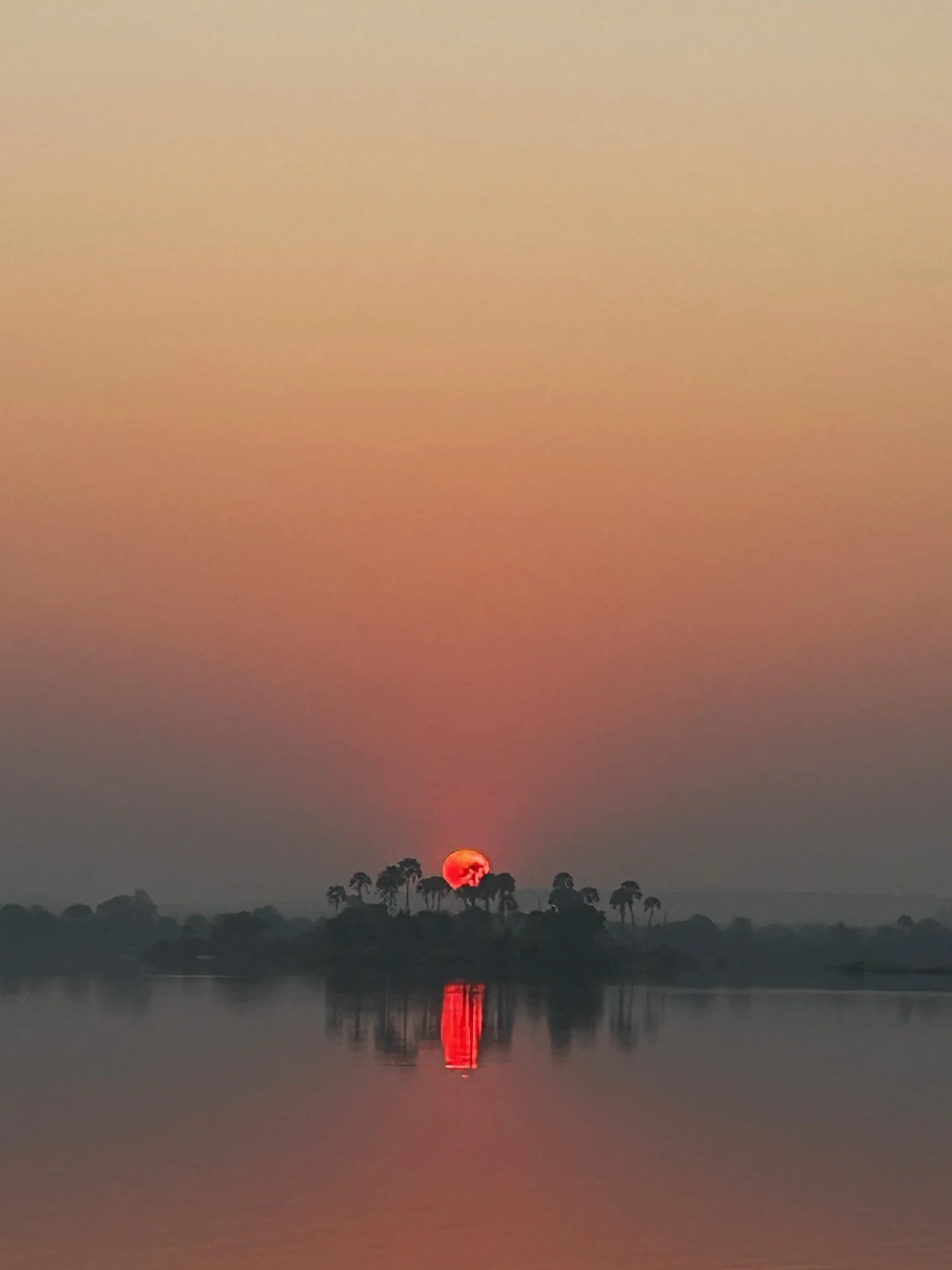 "Epic sunrise over the Zambezi River during a sunrise yoga session on a boat with Together we Breathe's wellbeing and safari retreat - a moment of awe and emotion."