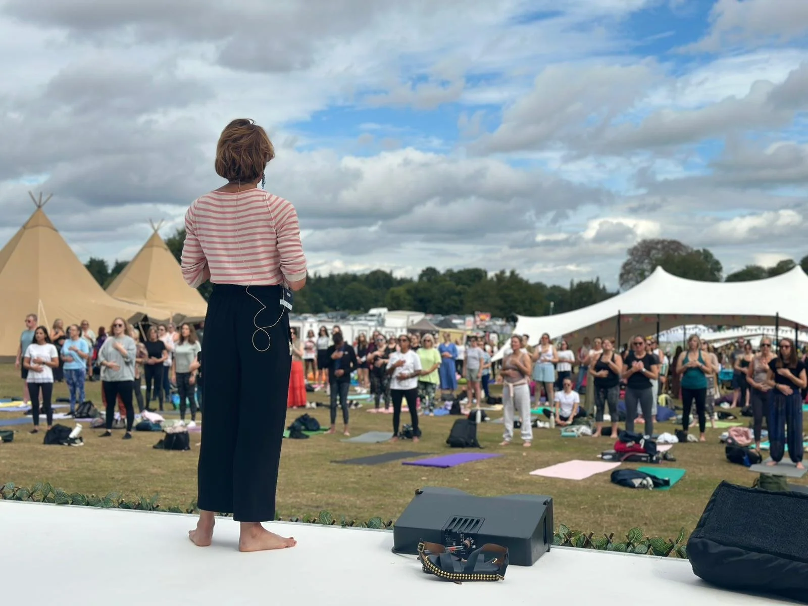 Kerry Flower leading a breathwork session on the main stage at Happy Place Festival in Manchester