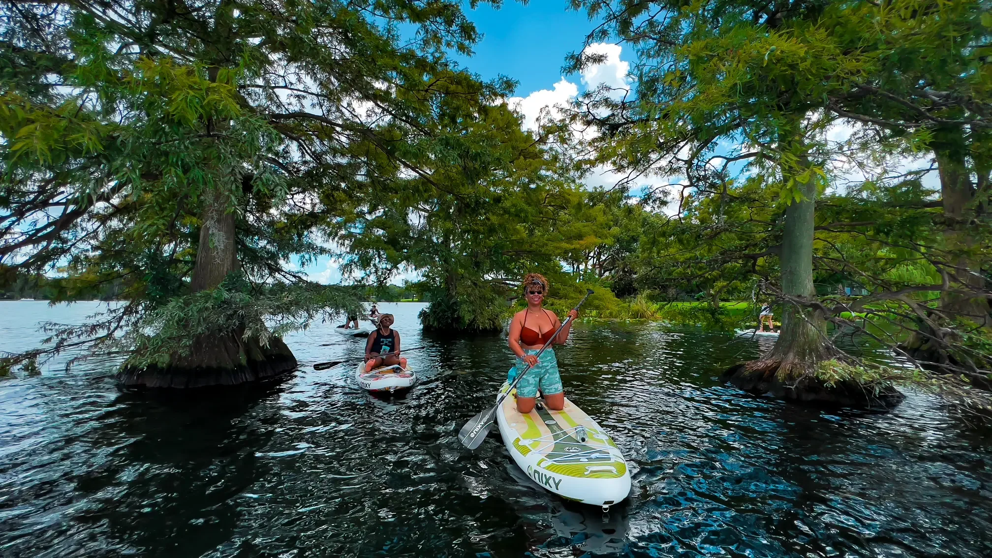 The best family friendly paddle boarding tours in Orlando with Otter Paddle Orlando on the Winter Park Chain of Lakes. 