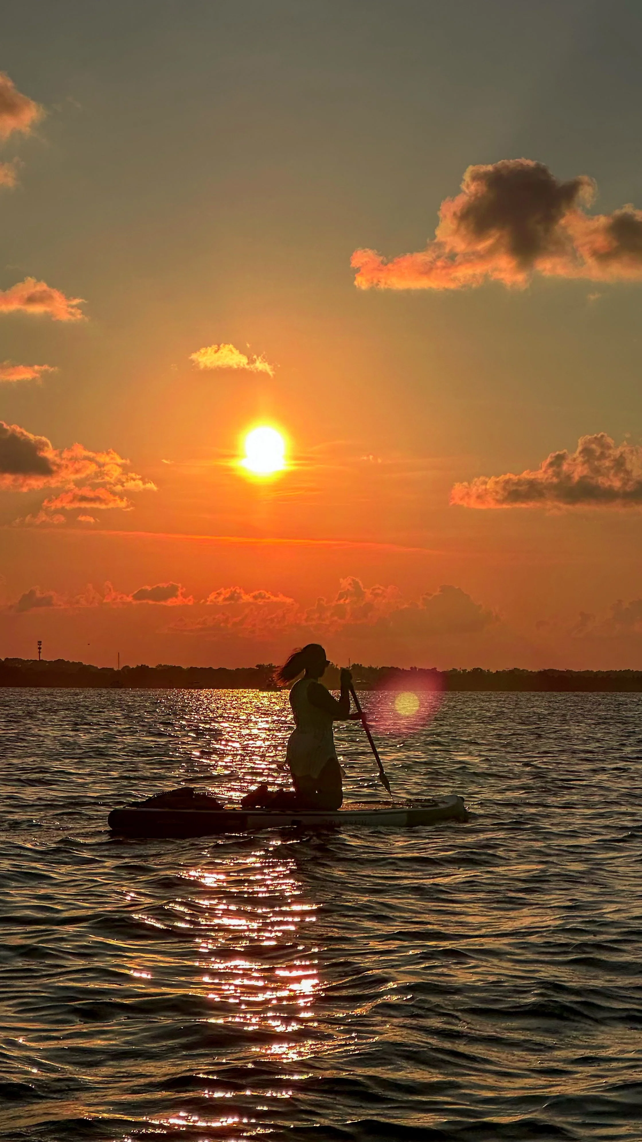 Guests on a guided bioluminescence paddle tour just one hour from Orlando.