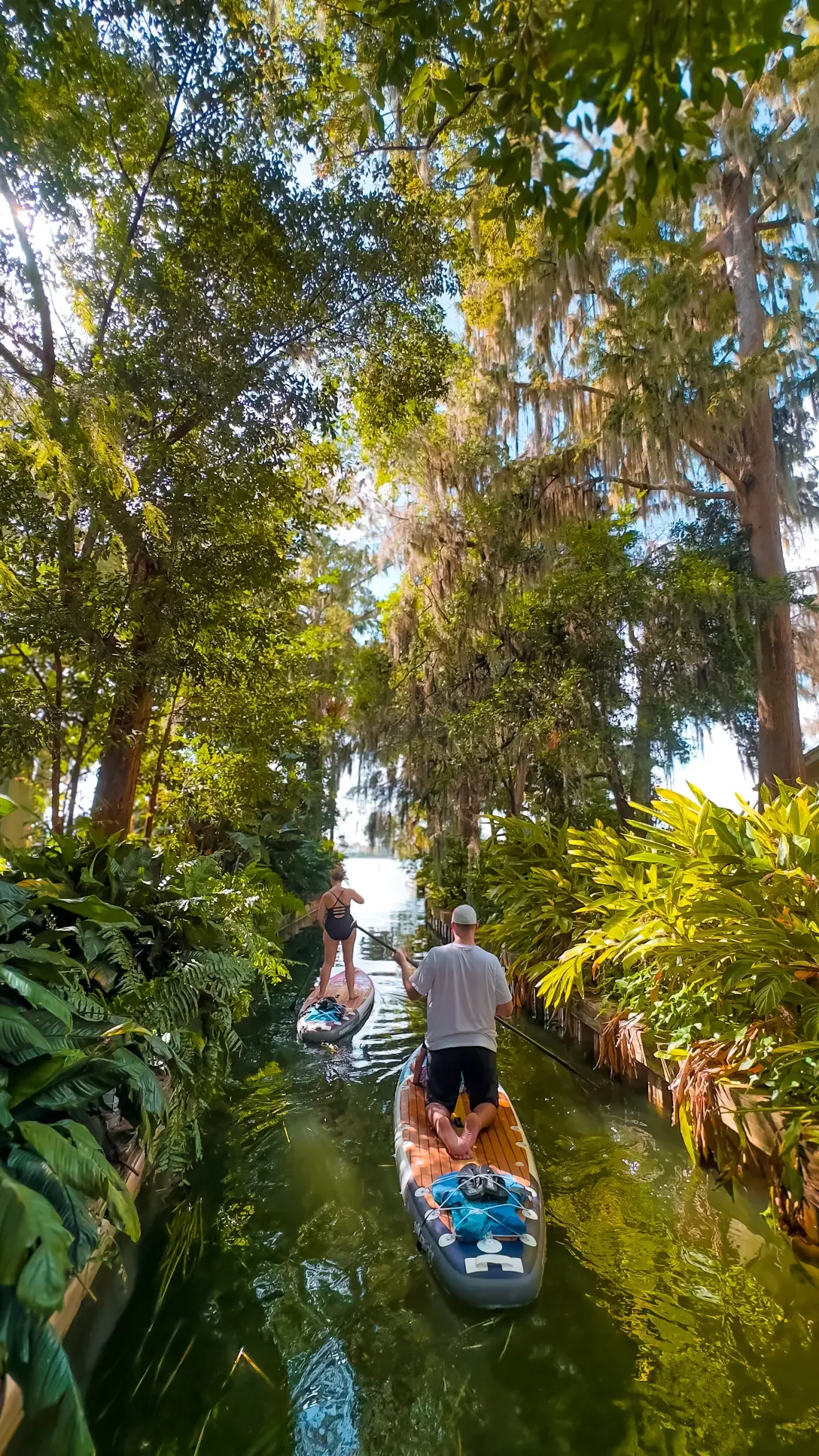 Paddleboarding the scenic canals on the Winter Park Chain of Lakes with Otter Paddle Orlando.