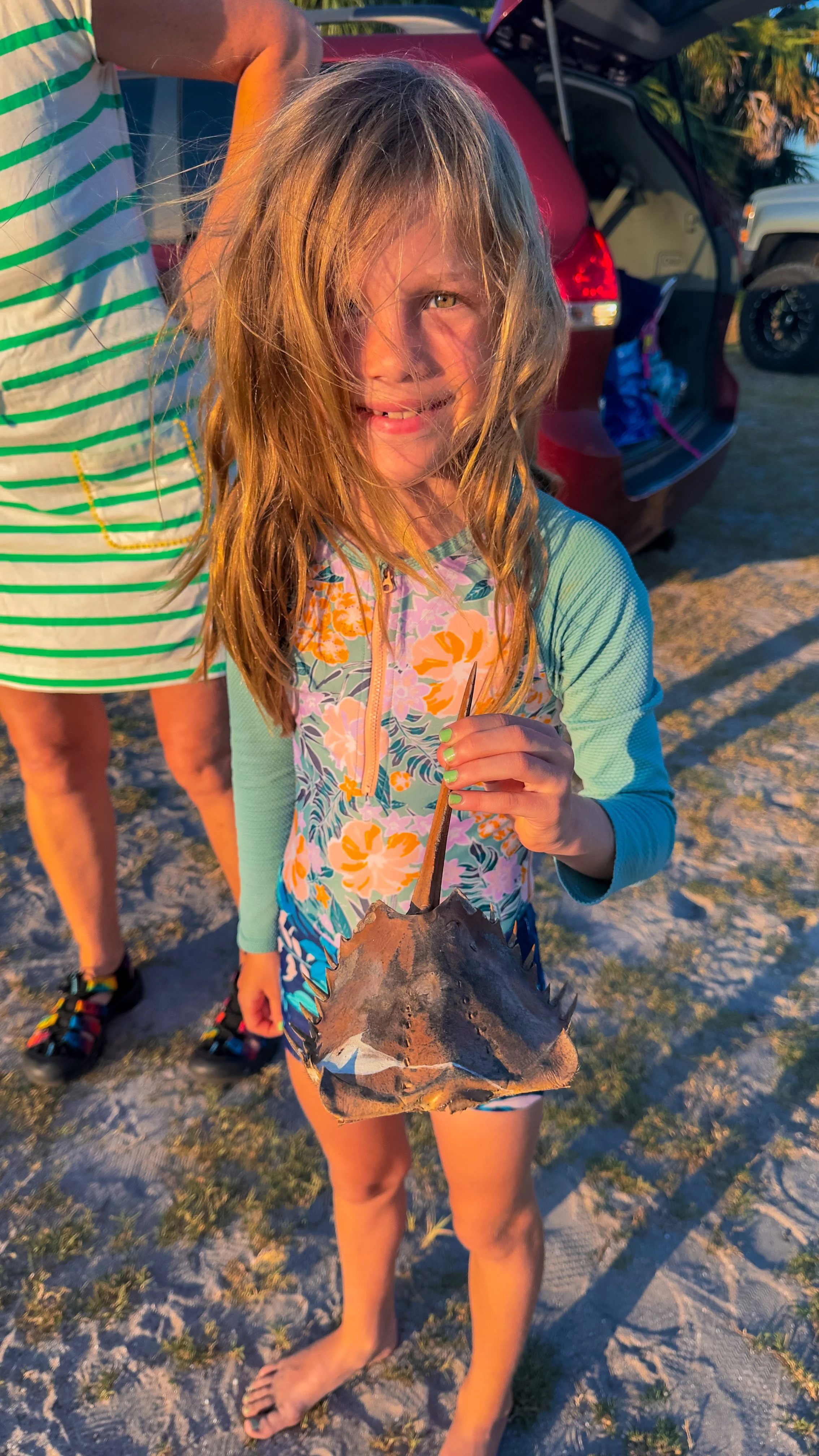Parents and kids experiencing bioluminescent waters together in a safe guided tour.
