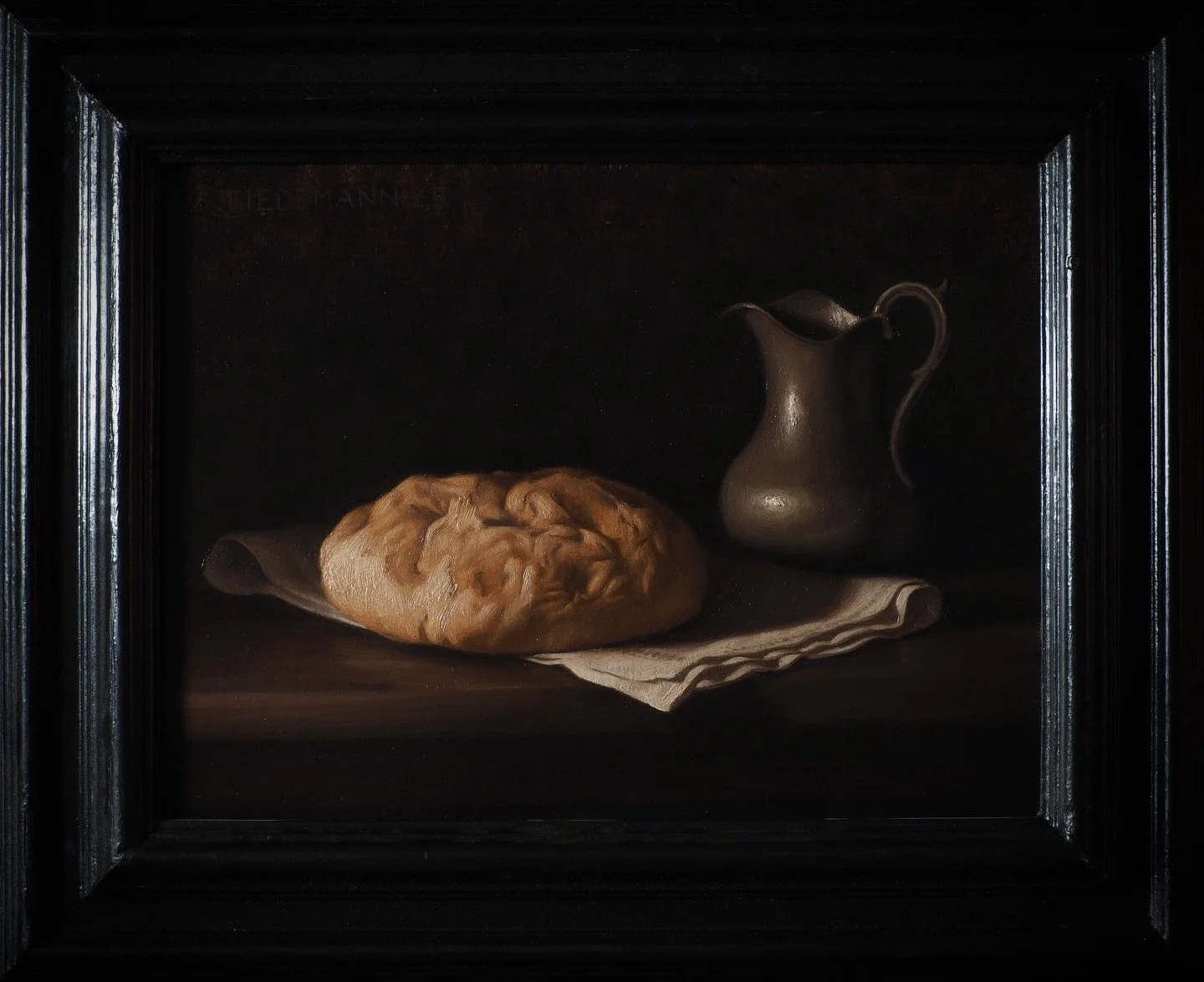 A still life composed of rather humble objects, some bread and a jug, which together point at the higher source of inspiration this painting was loosely based upon &mdash; the breaking of bread during the last supper.

This painting is framed and ava