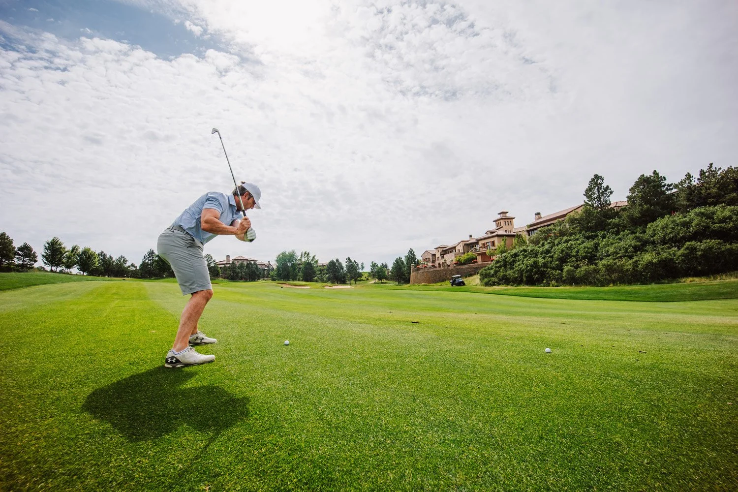 man playing on the 18th fairway on the weiskopf course