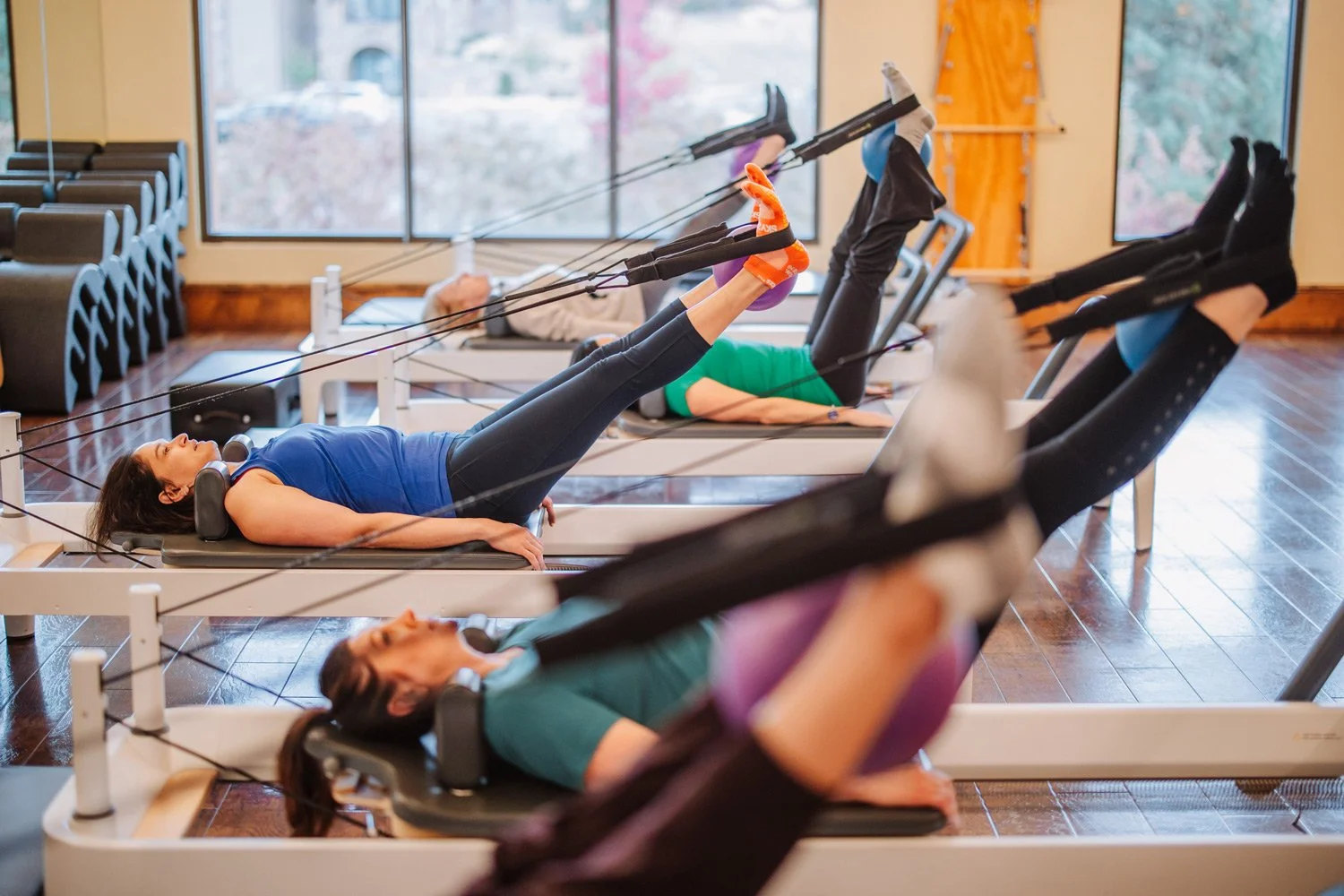 group of women participating in a pilates class