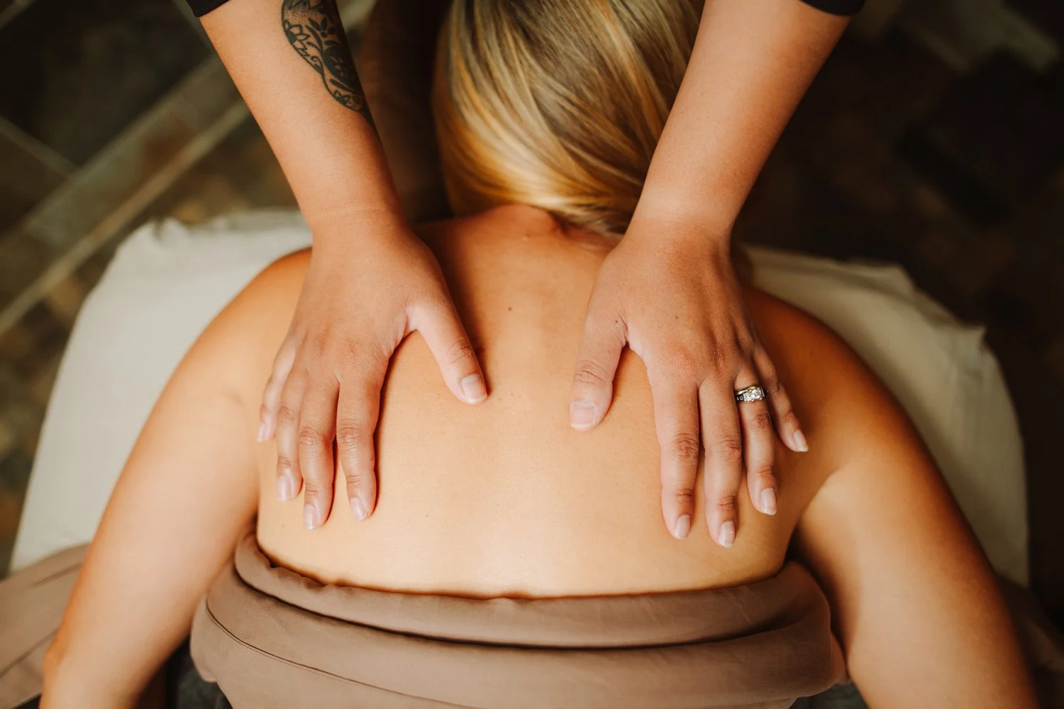 private spa treatment room receiving a massage
