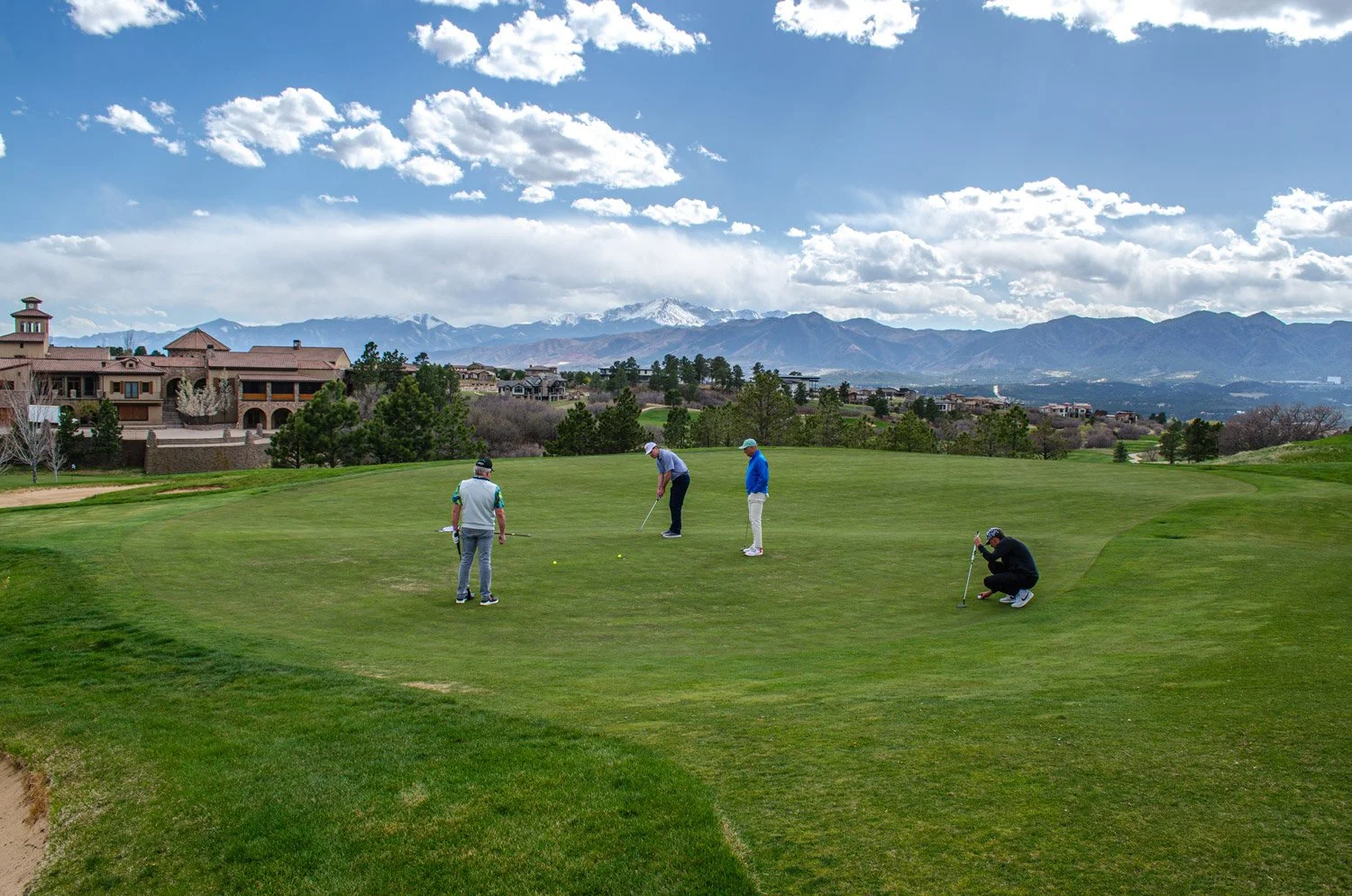 aerial image of clubhouse, main club course and the mountains