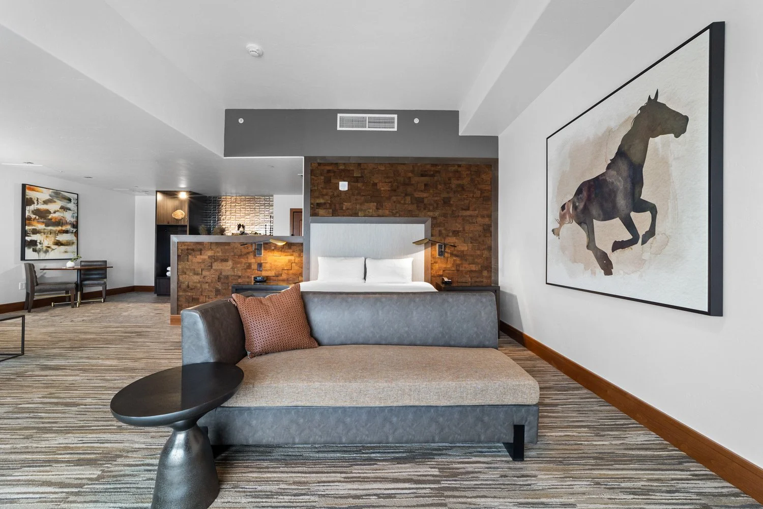 bed and couch in the academy suite