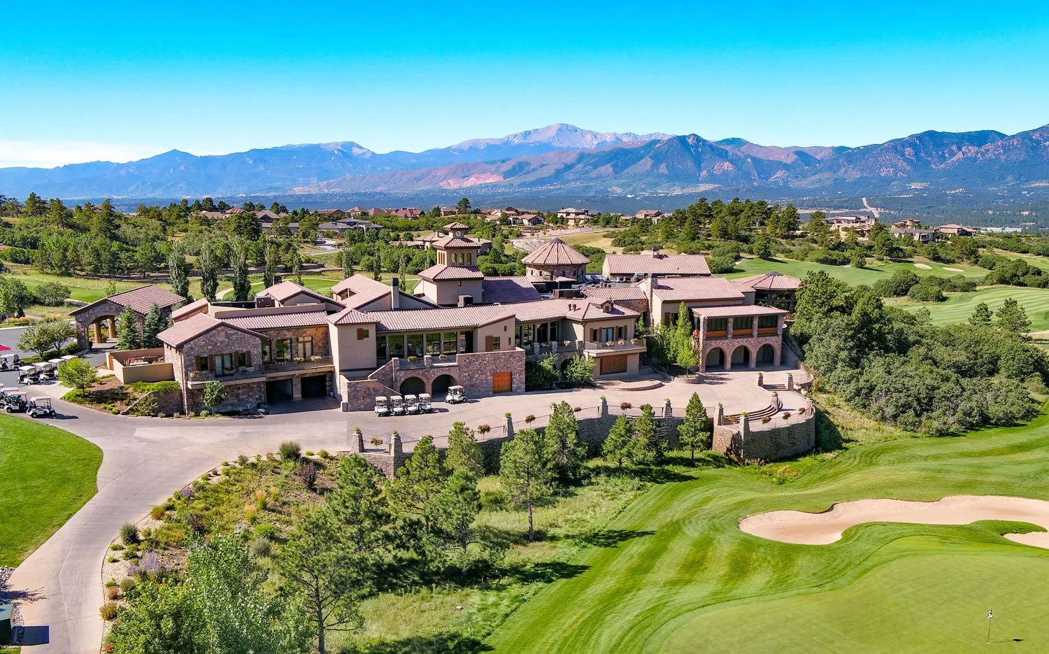 view of the mountains, the clubhouse and weiskopf golf course