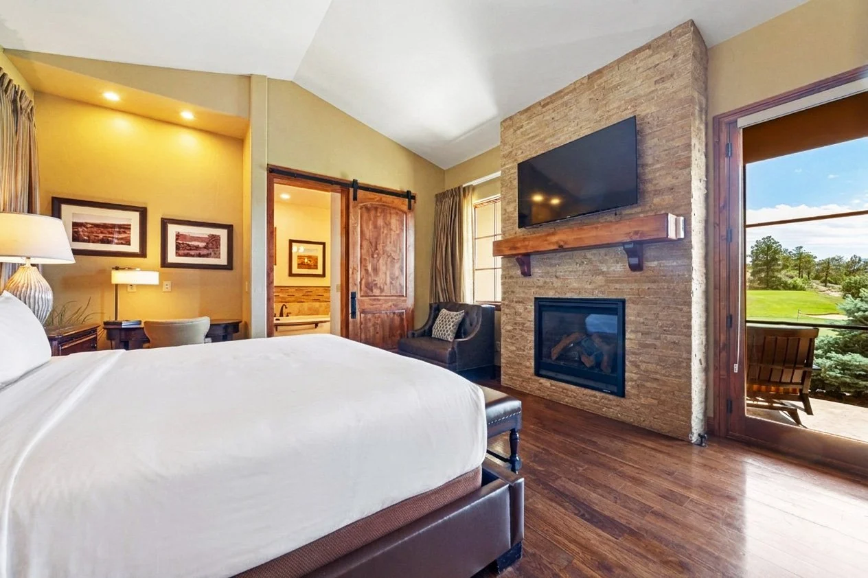 villa king room with access to private patio, fireplace and flatscreen tv