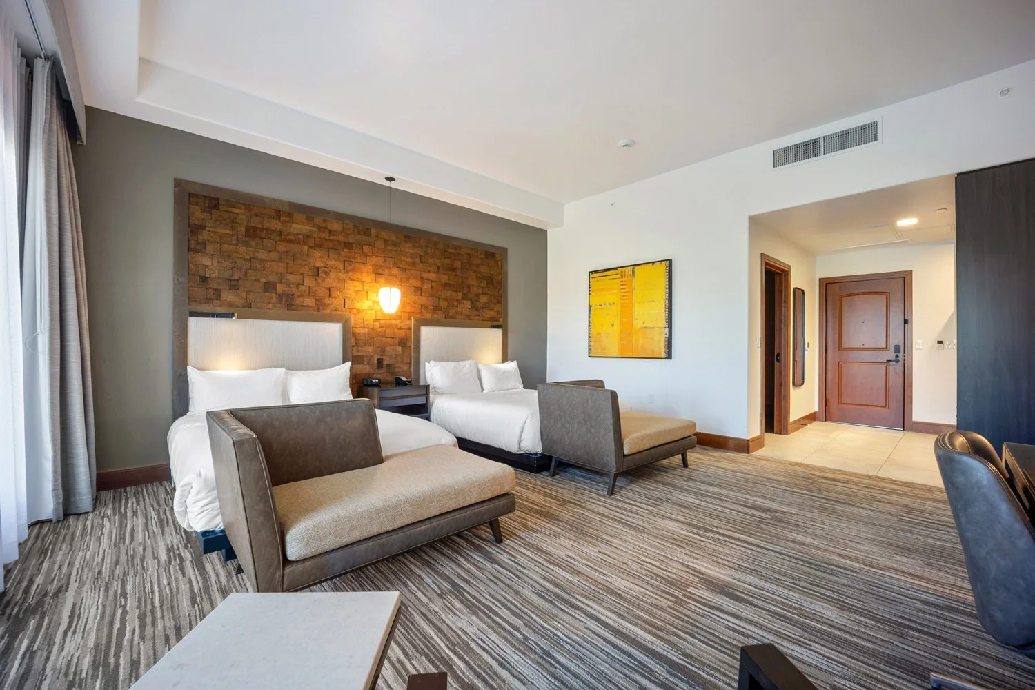 double queen guest room with chairs