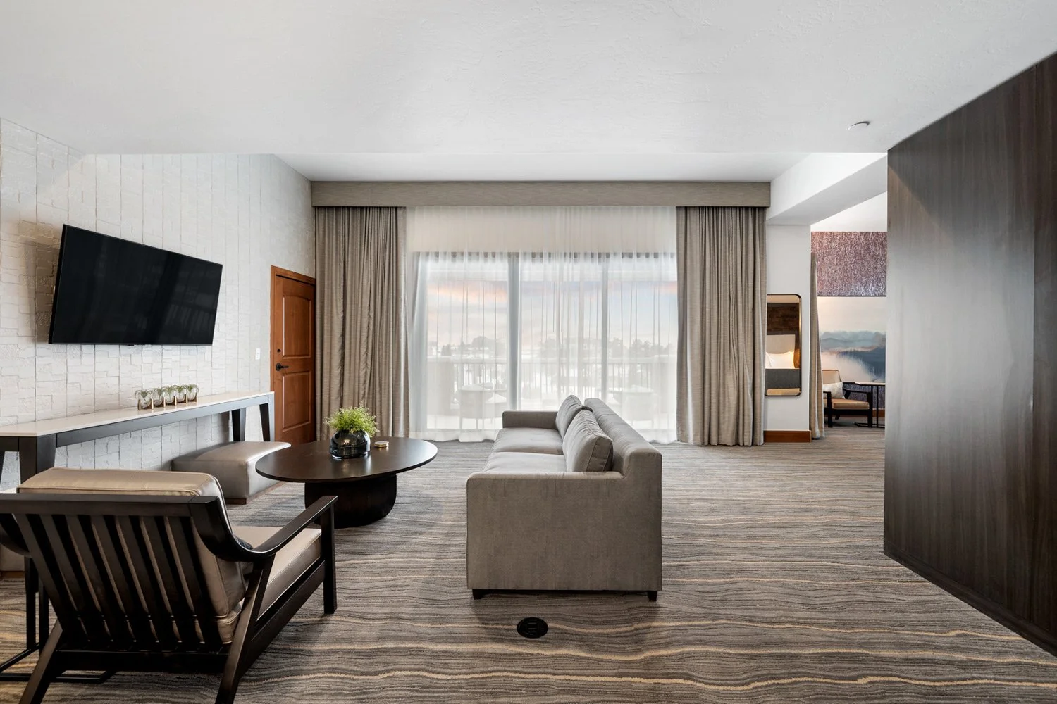 large sitting area with mountain views in the executive suite
