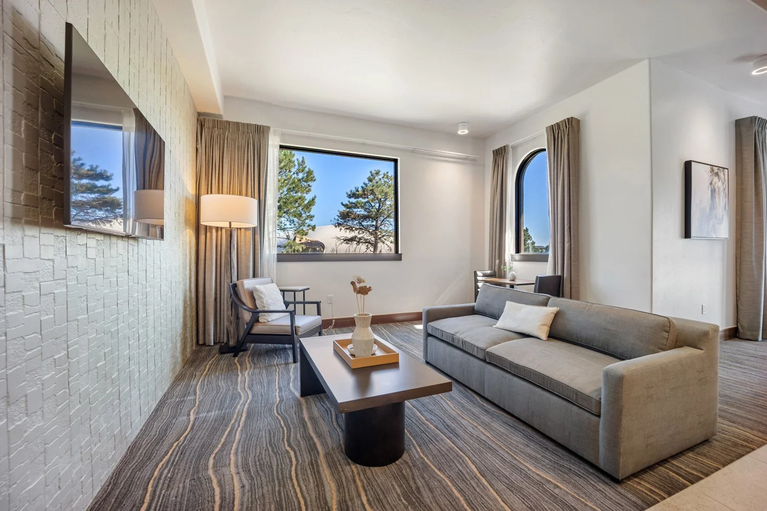 sitting area with windows in the deluxe suite