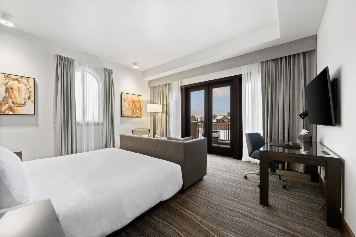 bed in deluxe suite with deck