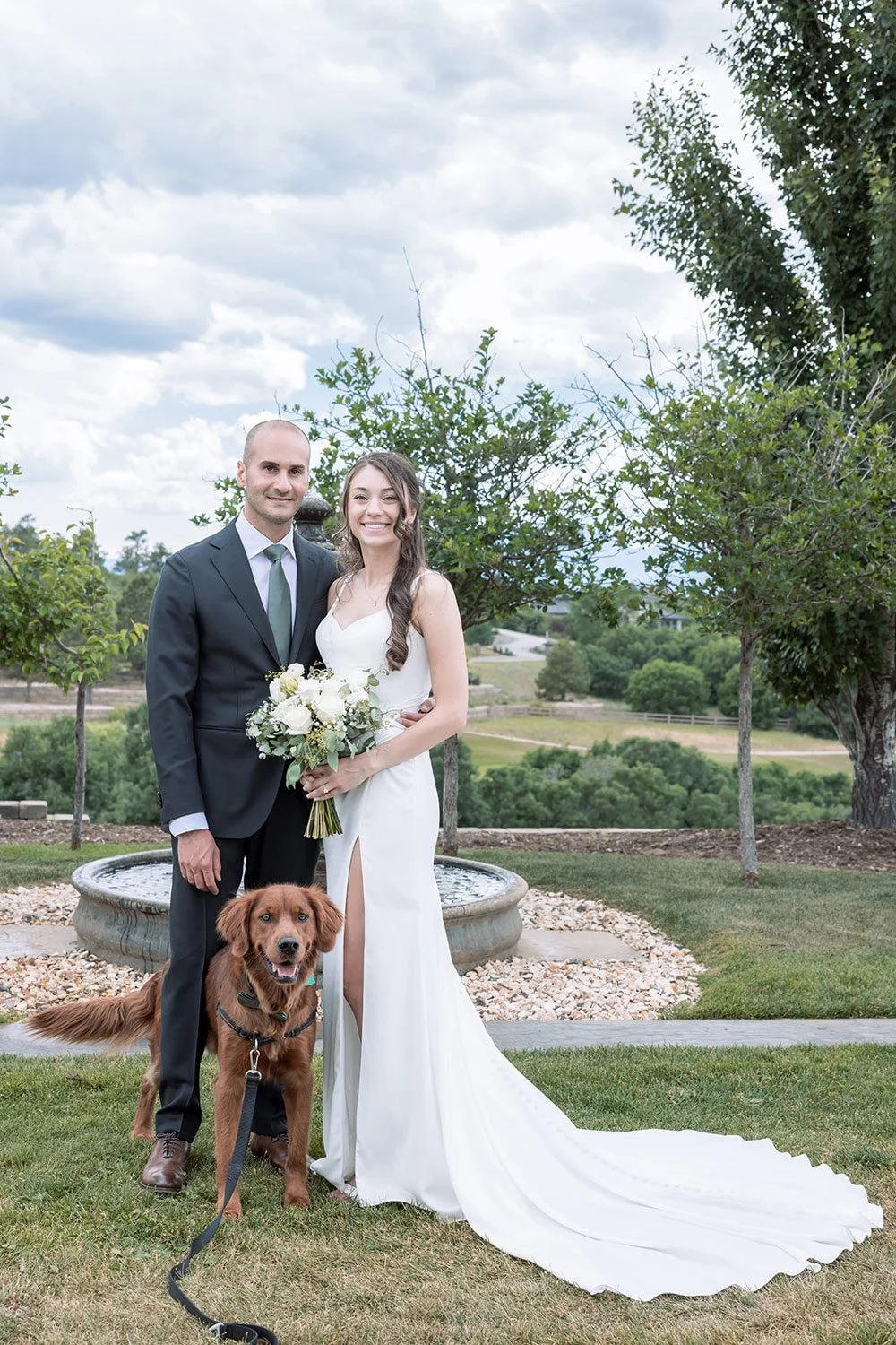bride and groom with their dog