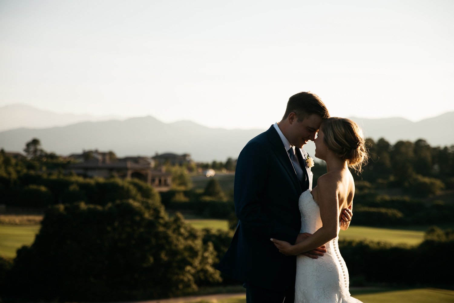 bride and groom photo of golf course and mountains