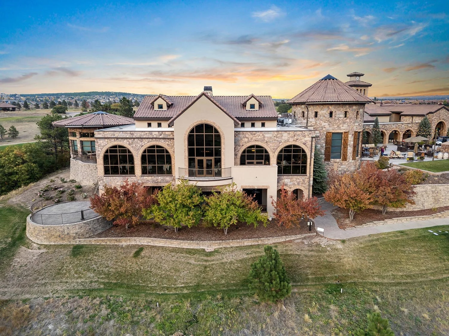 exterior of the steakhouse and wine tower at sunset