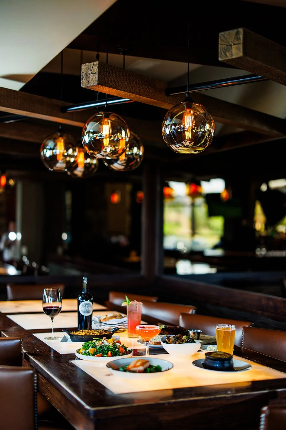 steakhouse bar ambiance in front of a mirror wall with ambient lighting 