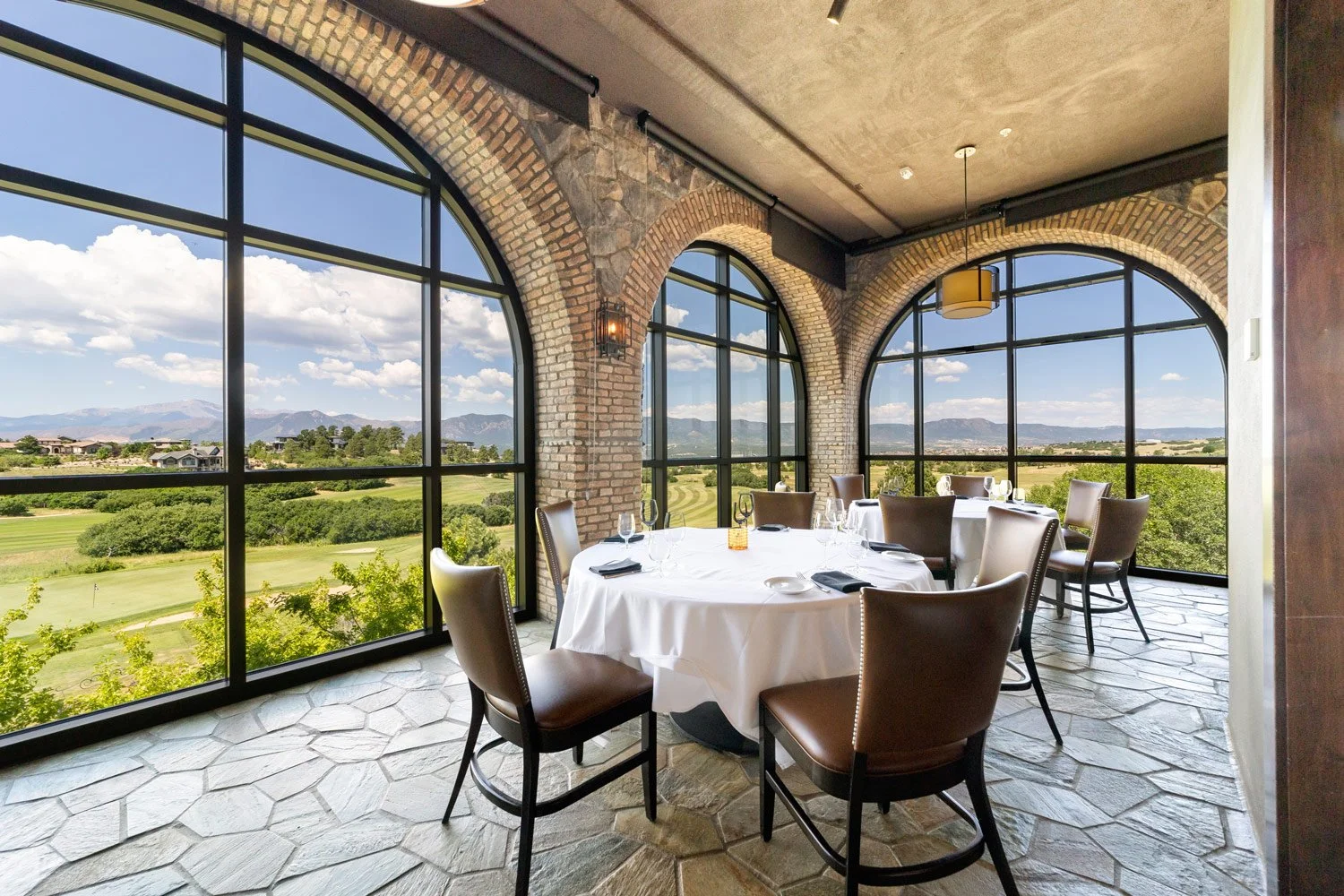 flying horse steakhouse views through the three arch bay windows of the championship golf course on a sunny day
