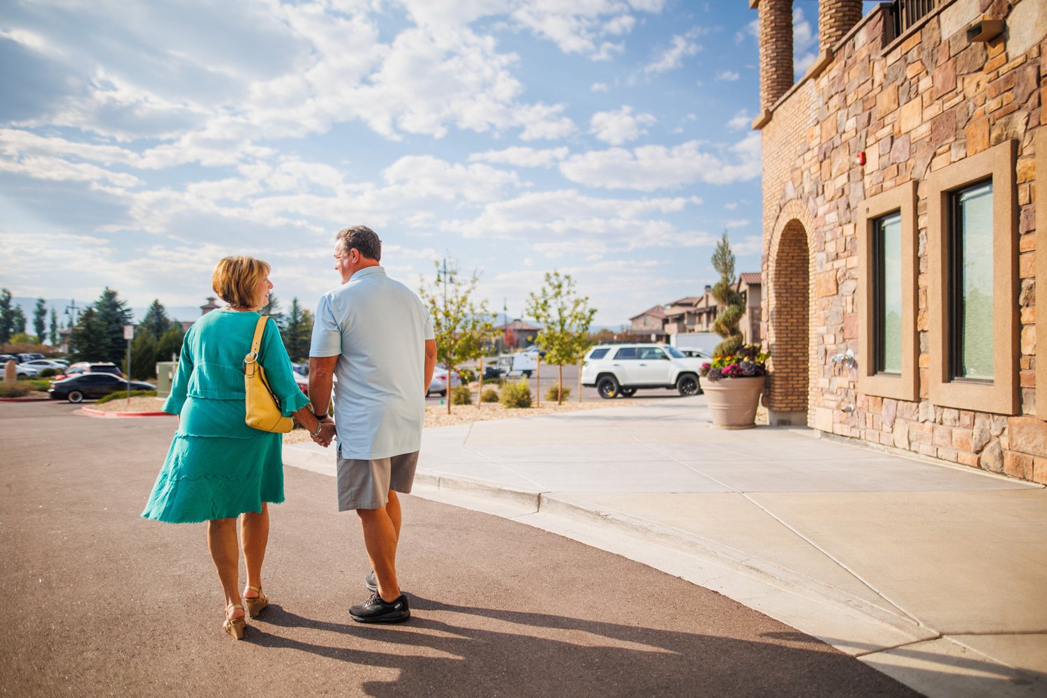couple walking in front of the hotel