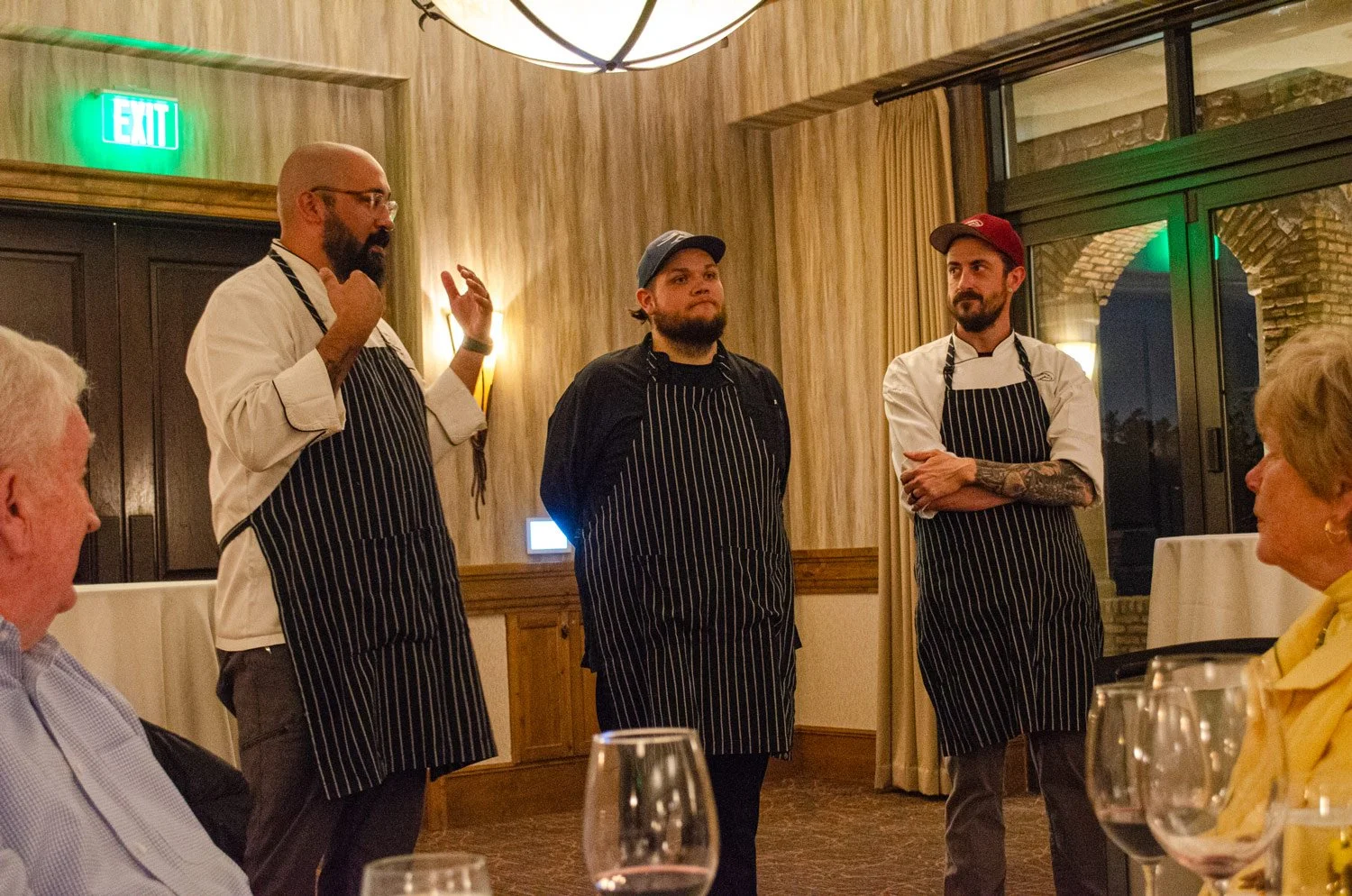 culinary chefs explaining the details of the cuisine at the flowers wine dinner
