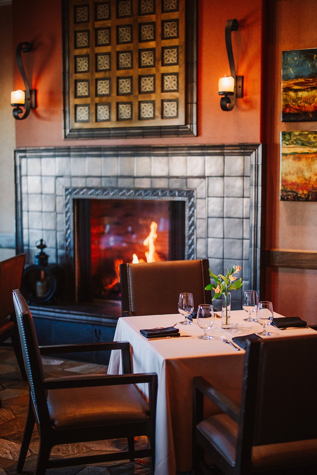 tack room fireplace with seating for four