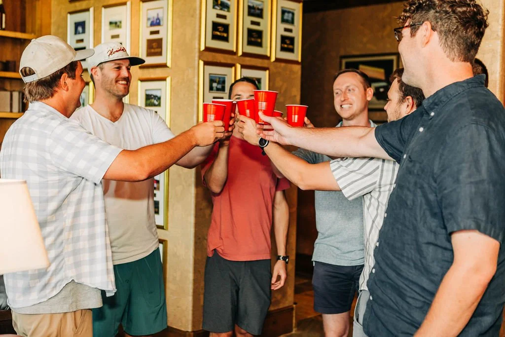 mens locker room cheers with groomsmen