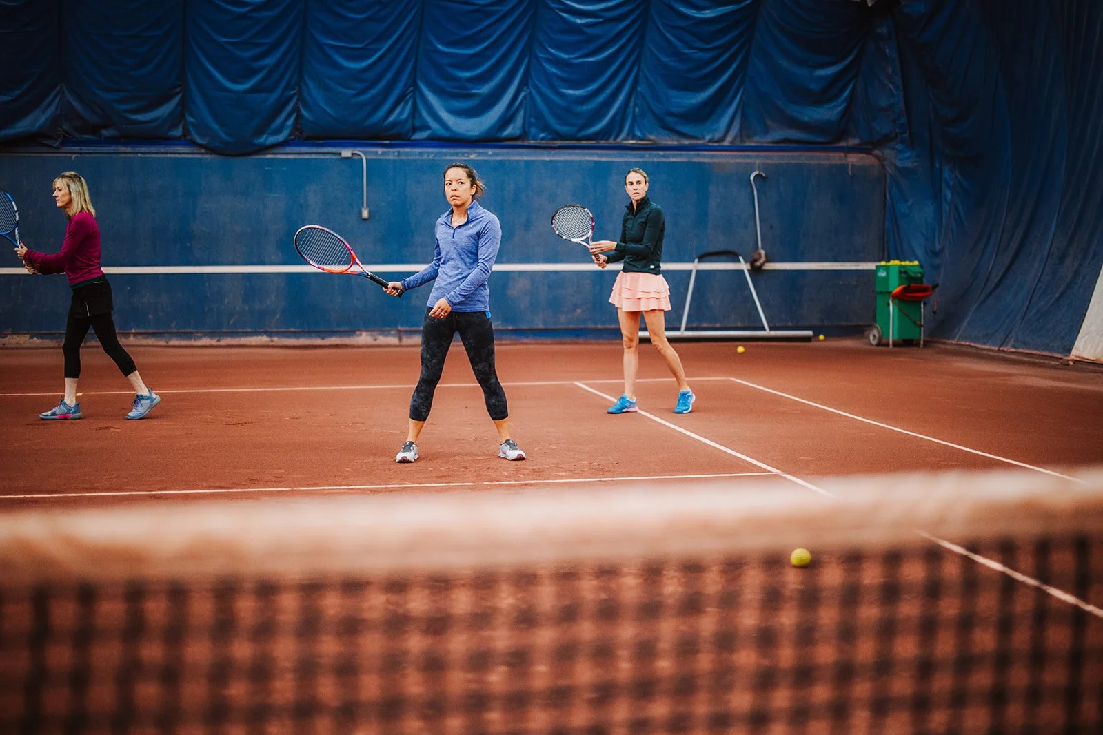 trio tennis lesson in the indoor clay courts
