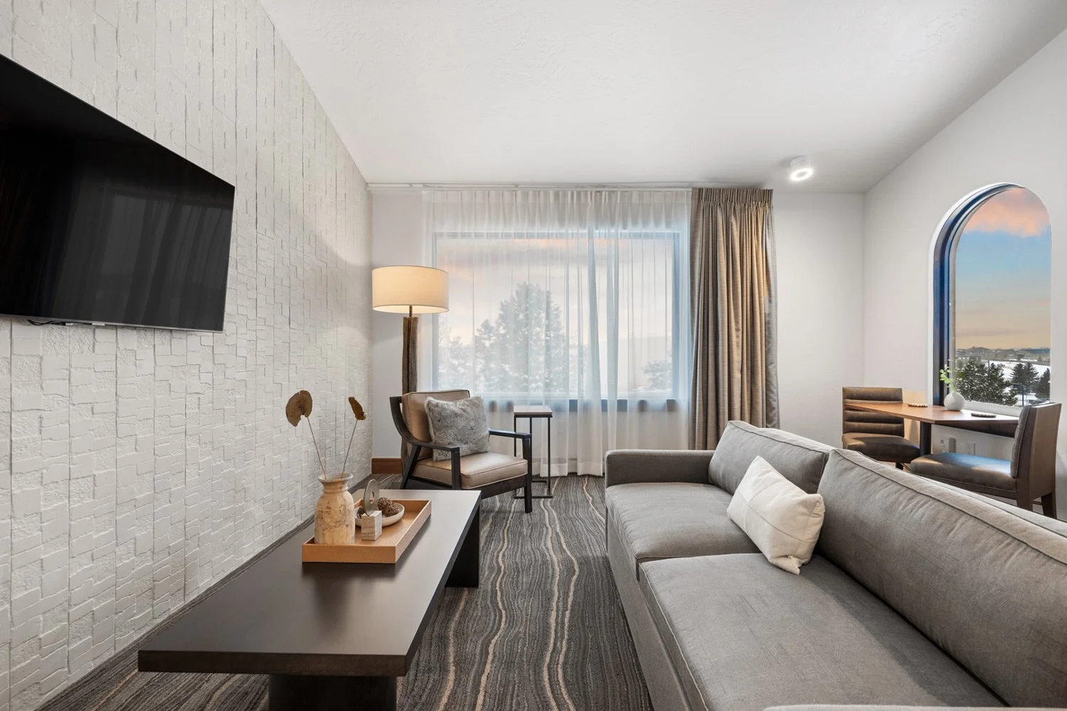 deluxe suite with sitting area and window