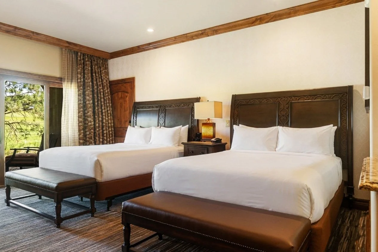 double queen room with chairs