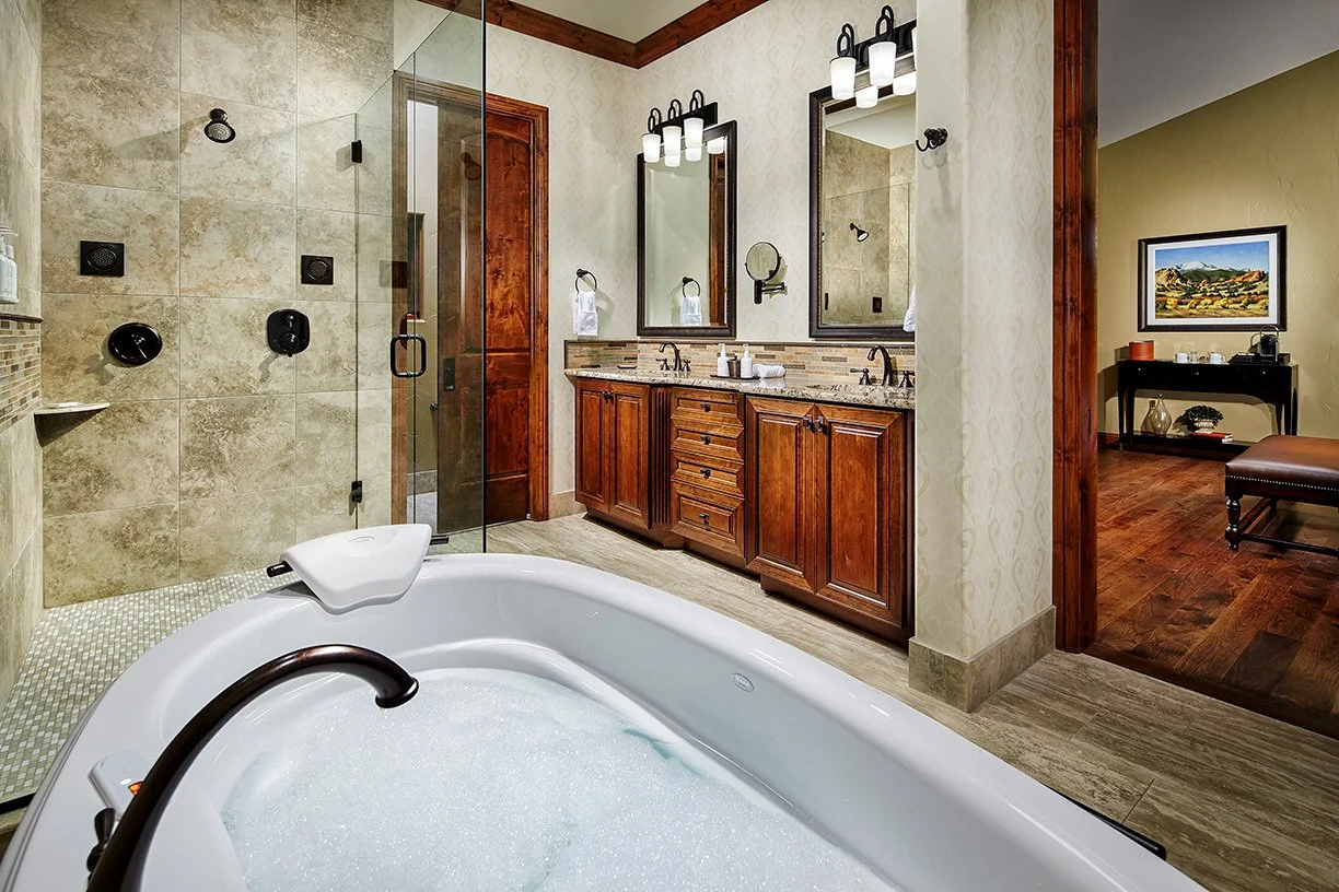 Villa with a soaking tub and walk in shower and powder room