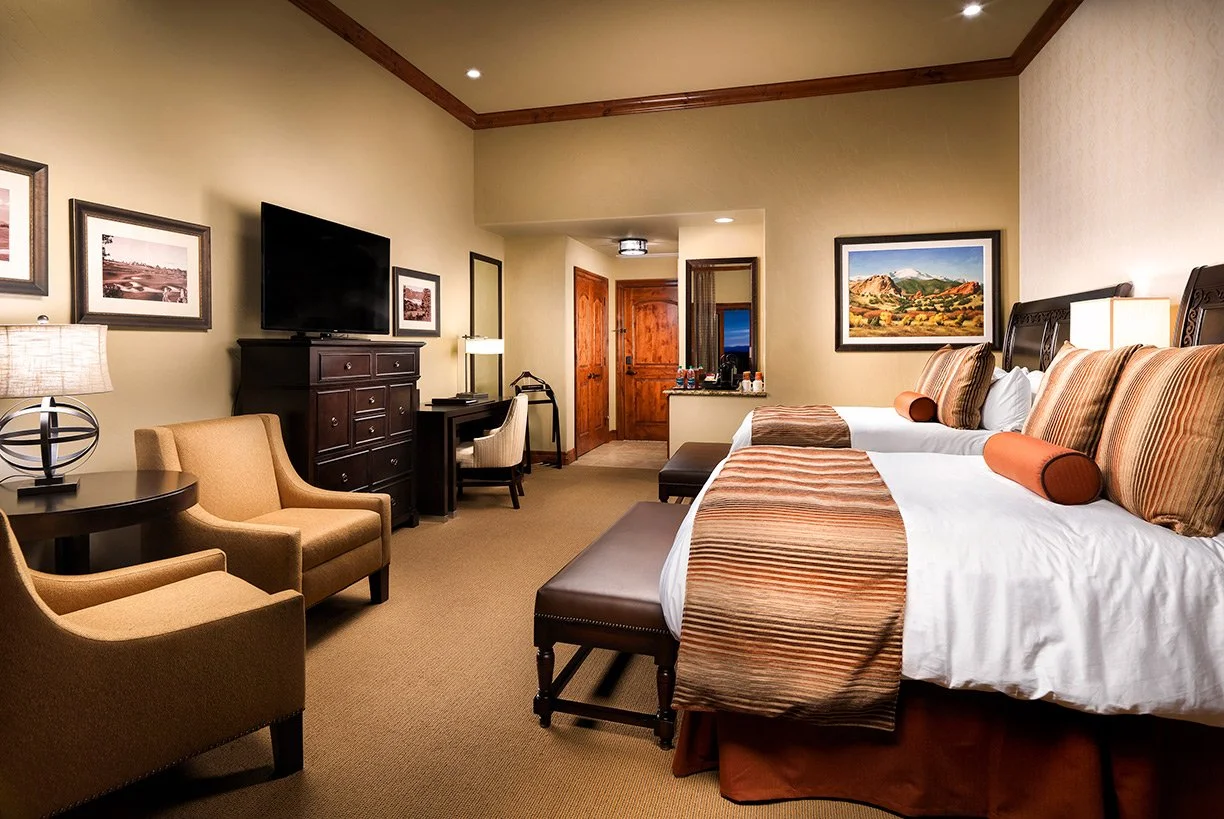 double queen guest room with chairs