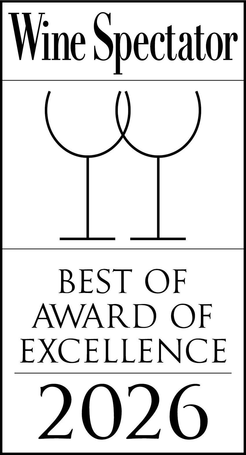 A certificate titled 'Wine Spectator Best of Award of Excellence 2026' with a minimalistic line drawing of two wine glasses.